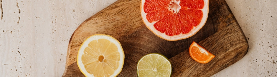 Wooden cutting board with fruits on top