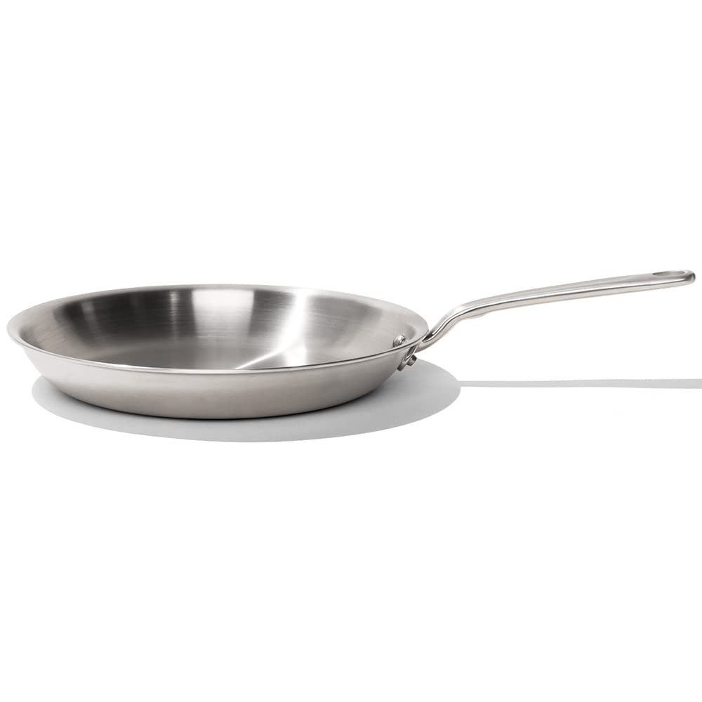 Stainless steel frying pan on a white background