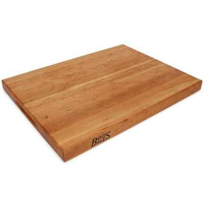 Wooden cutting board with 'Boo's' branding on a white background