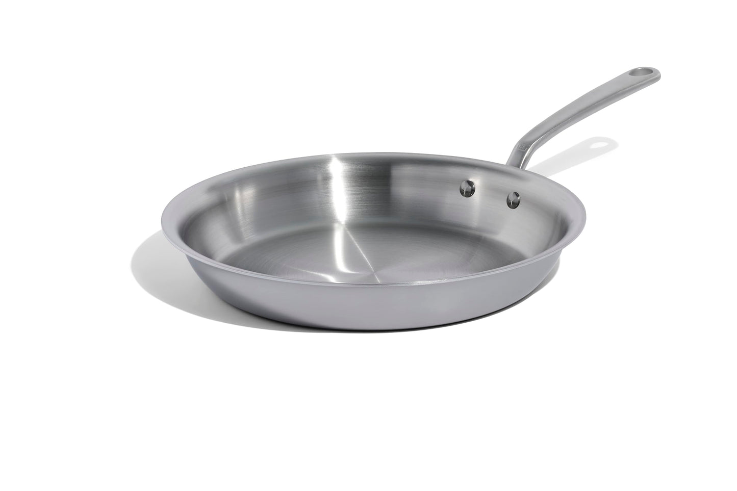 Stainless steel frying pan on a white background