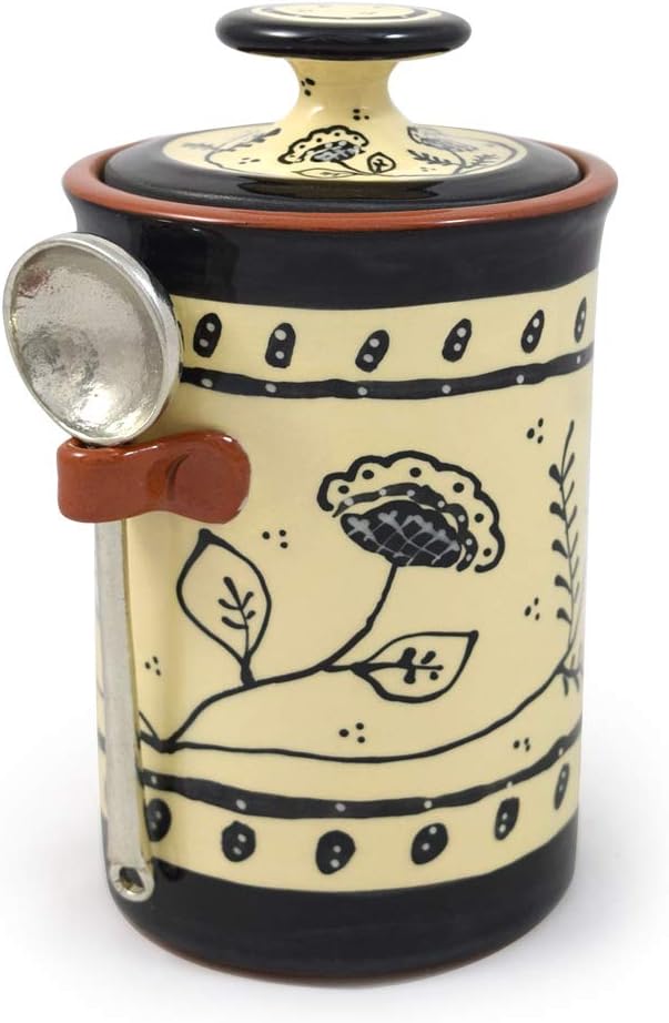 American terracotta canister pewter scoop with floral design on a white background