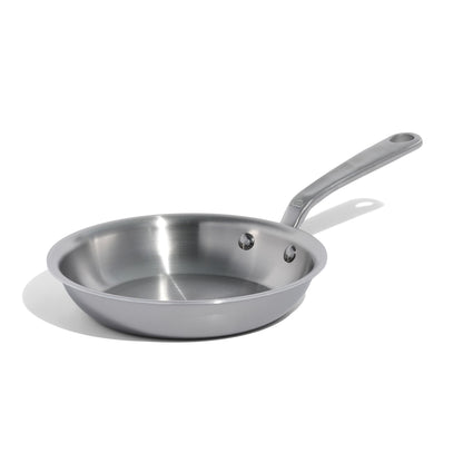Stainless steel frying pan on a white background