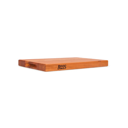 Wooden cutting board with 'Boos' branding on a white background