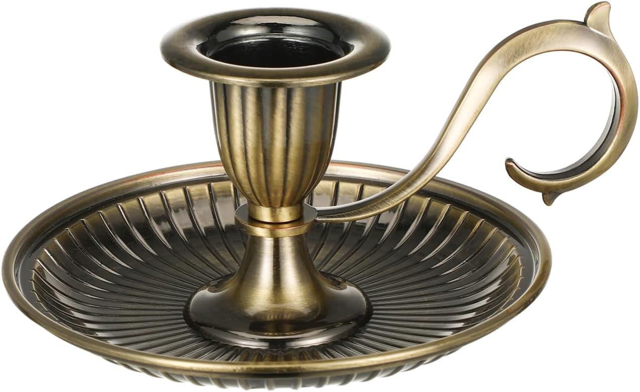 Bronze candle holder with a handle on a white background