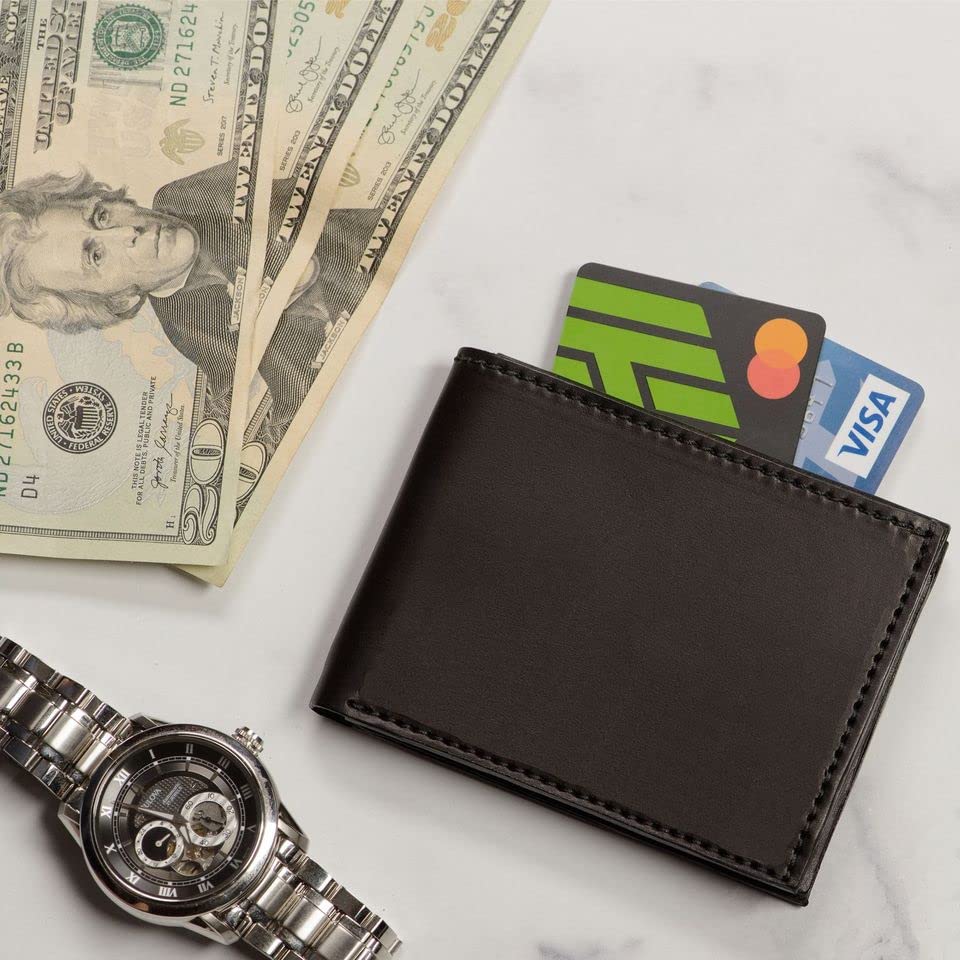 Black wallet with cards, dollar bills, and a watch on a light surface