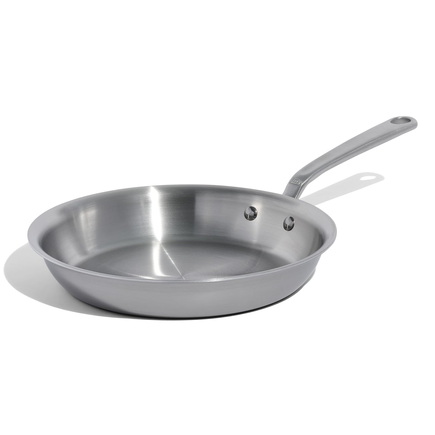 Stainless steel frying pan on a white background