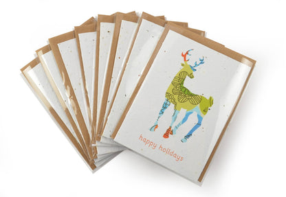 Set of greeting cards with a colorful giraffe illustration and 'happy holidays' text on a white background.