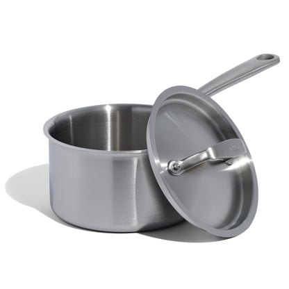 Stainless steel saucepan with lid on a white background