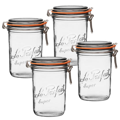 Set of four clear glass jars with metal clamps on a white background