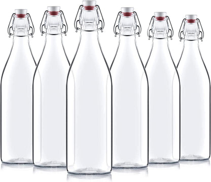 Set of six Bormioli rocco giara swing top bottles with metal clamps on a white background