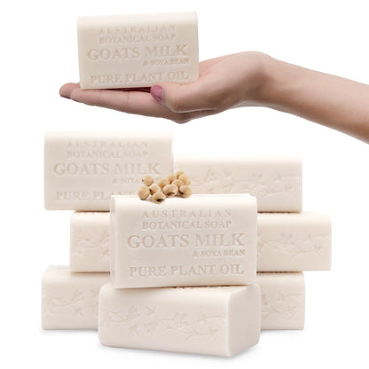 Hand holding a bar of Australian Botanical Soap with Goats Milk and Pure Plant Oil, surrounded by more soap bars on a white background.