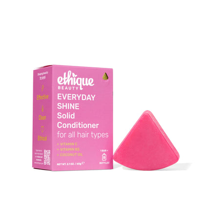 Pink 'ethique beauty' solid conditioner bar and packaging on a white background