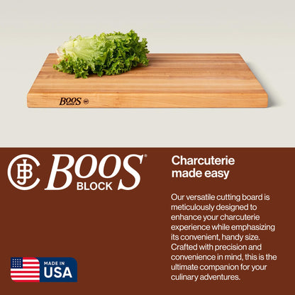 Wooden cutting board with lettuce on a light gray background, featuring the Boos Block brand.