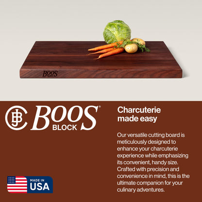 Wooden cutting board with vegetables on a light background, featuring the Boos Block brand.