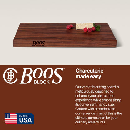 Wooden cutting board with 'Boos Block' branding and text about the product on a beige background.