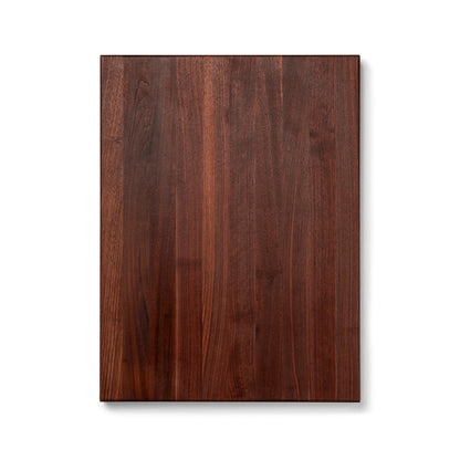 Wooden cutting board with a dark brown finish on a white background