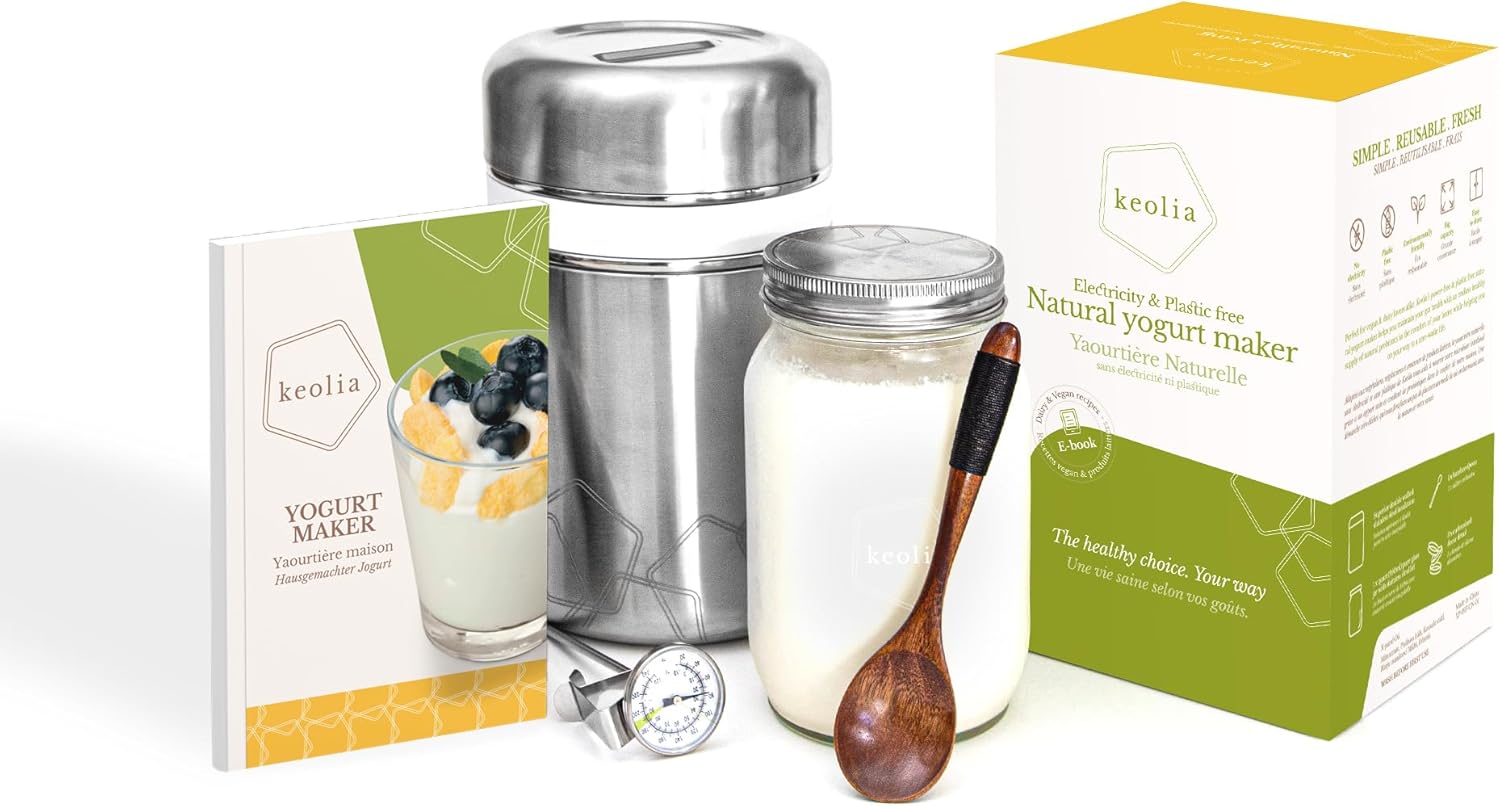 Keolia yogurt maker with packaging, jar, and wooden spoon on a white background