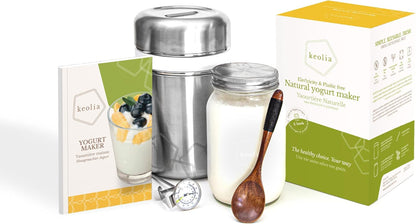 Keolia yogurt maker with packaging, jar, and wooden spoon on a white background