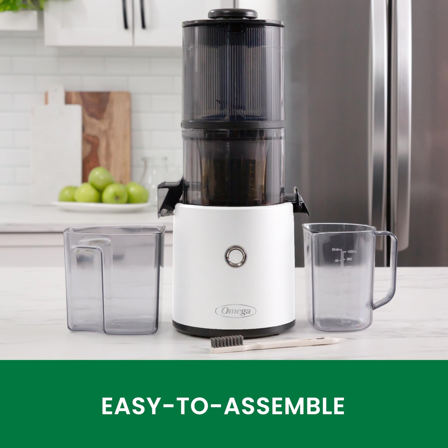 White juicer with clear containers on a kitchen counter, labeled 'Easy-to-Assemble'.