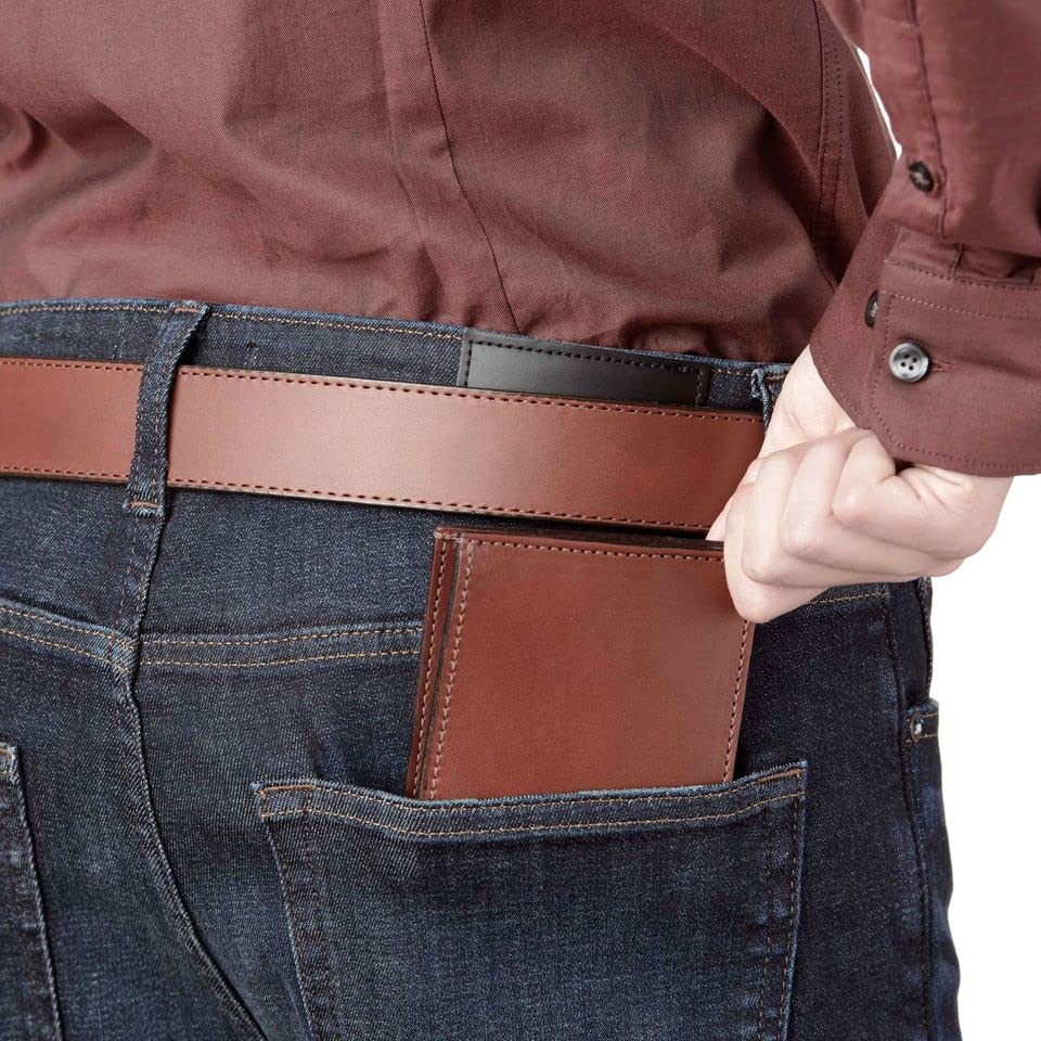 Person wearing a brown leather wallet in their jeans pocket.