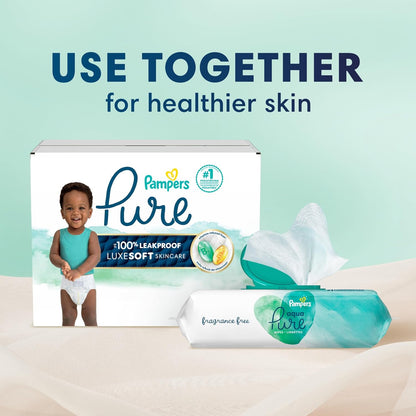 Pampers Pure diaper box with a baby and a pack of wipes on a light green background