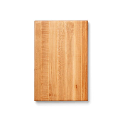 Wooden cutting board on a white background