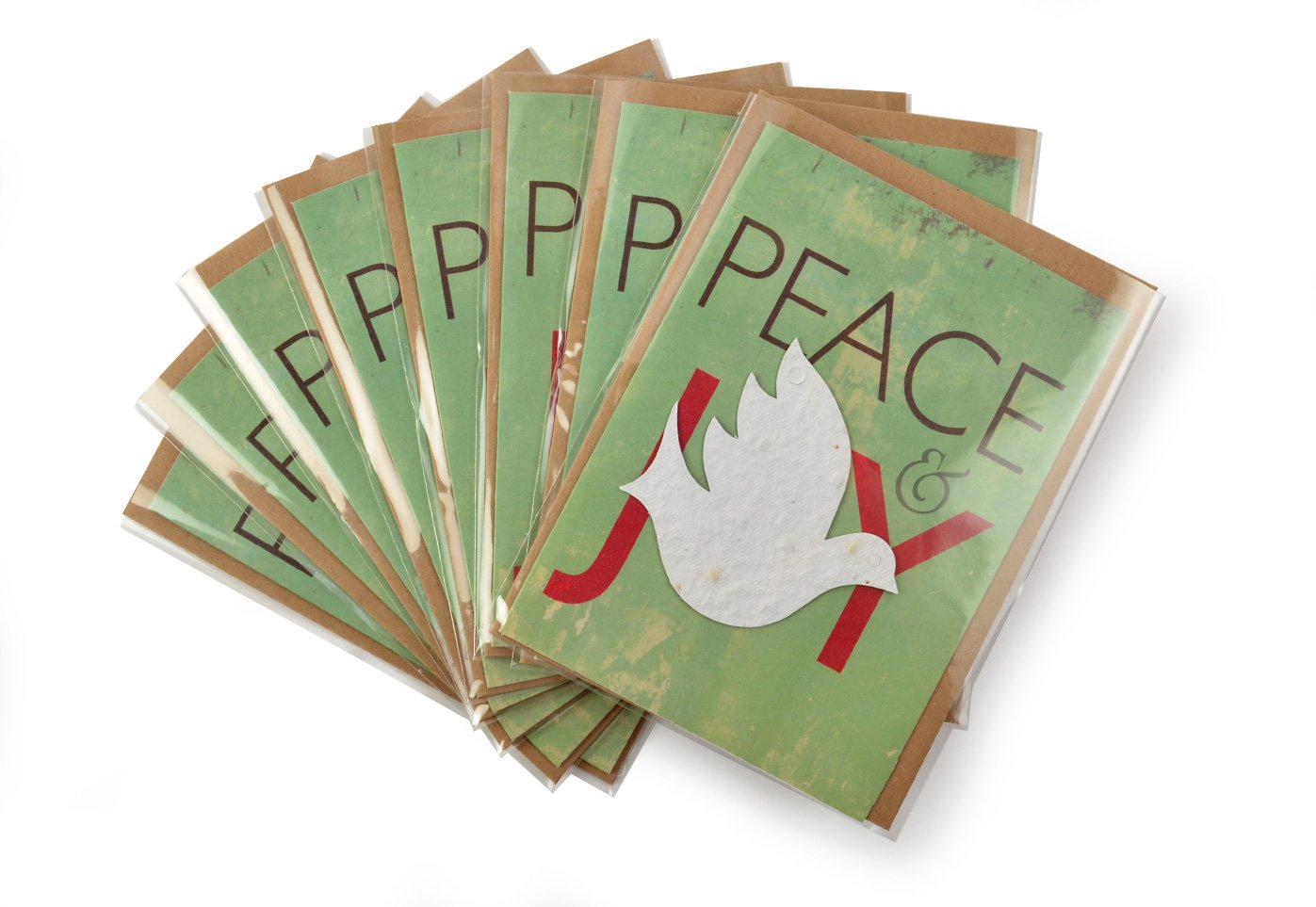 Stack of greeting cards with 'Peace' and dove design on a white background