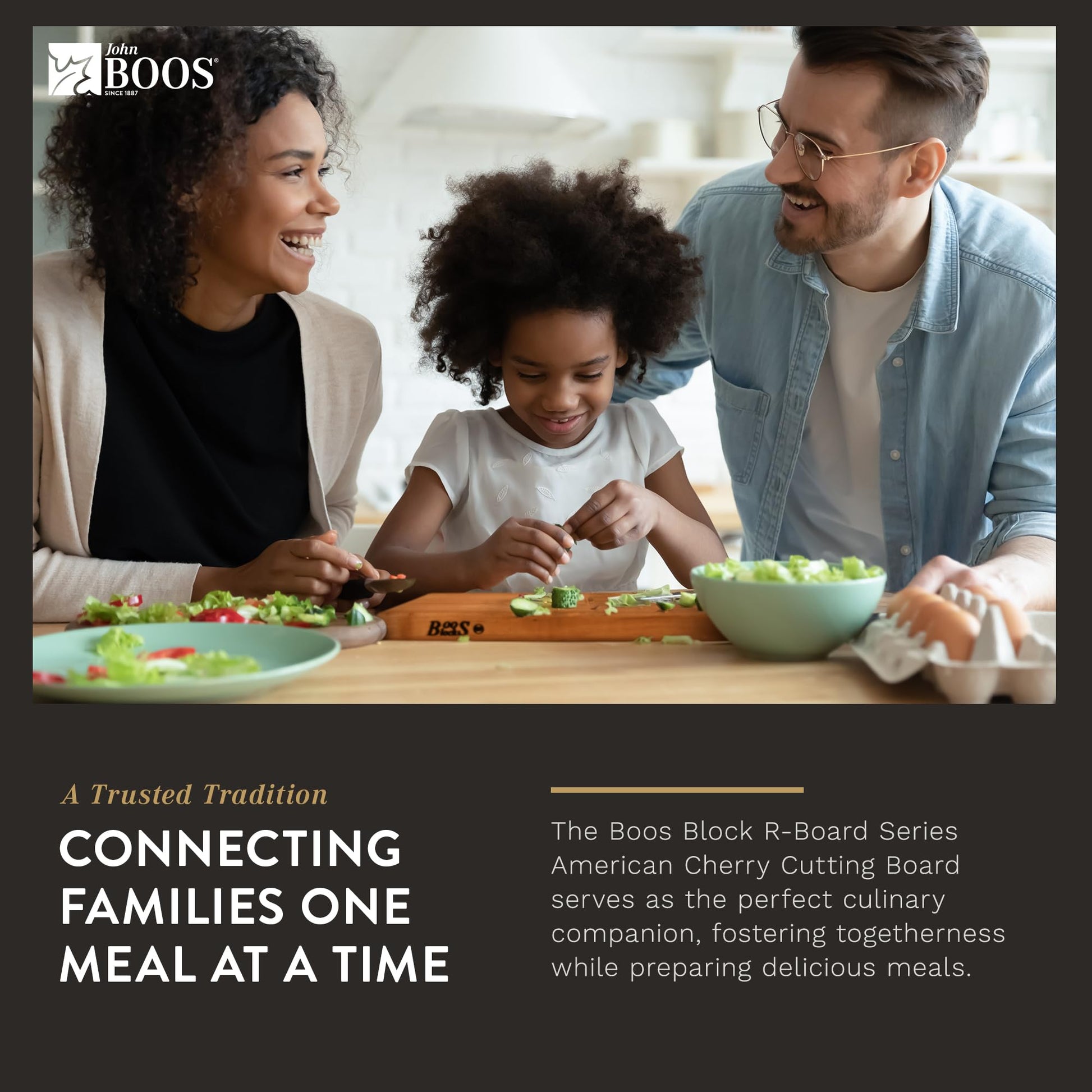 Family of three at a dining table with a Boos Block R-Board Series cutting board.