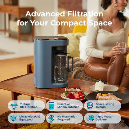 Blue water filter pitcher on a table with a woman sitting in the background, featuring text about advanced filtration.