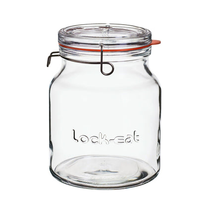 Clear glass jar with a clamp lid on a white background