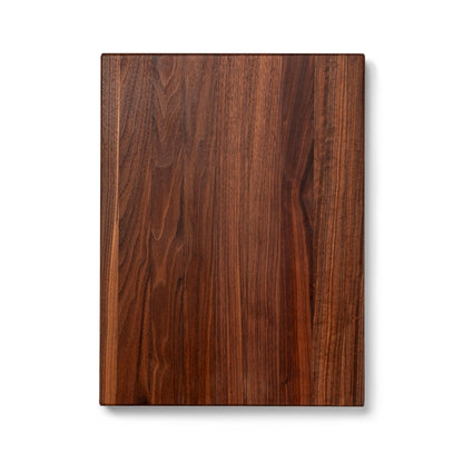 Wooden cutting board with a dark brown finish on a white background