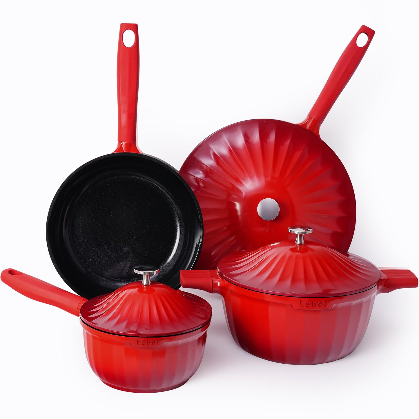 Set of red cookware including pots and a frying pan on a white background