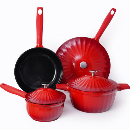 Set of red cookware including pots and a frying pan on a white background