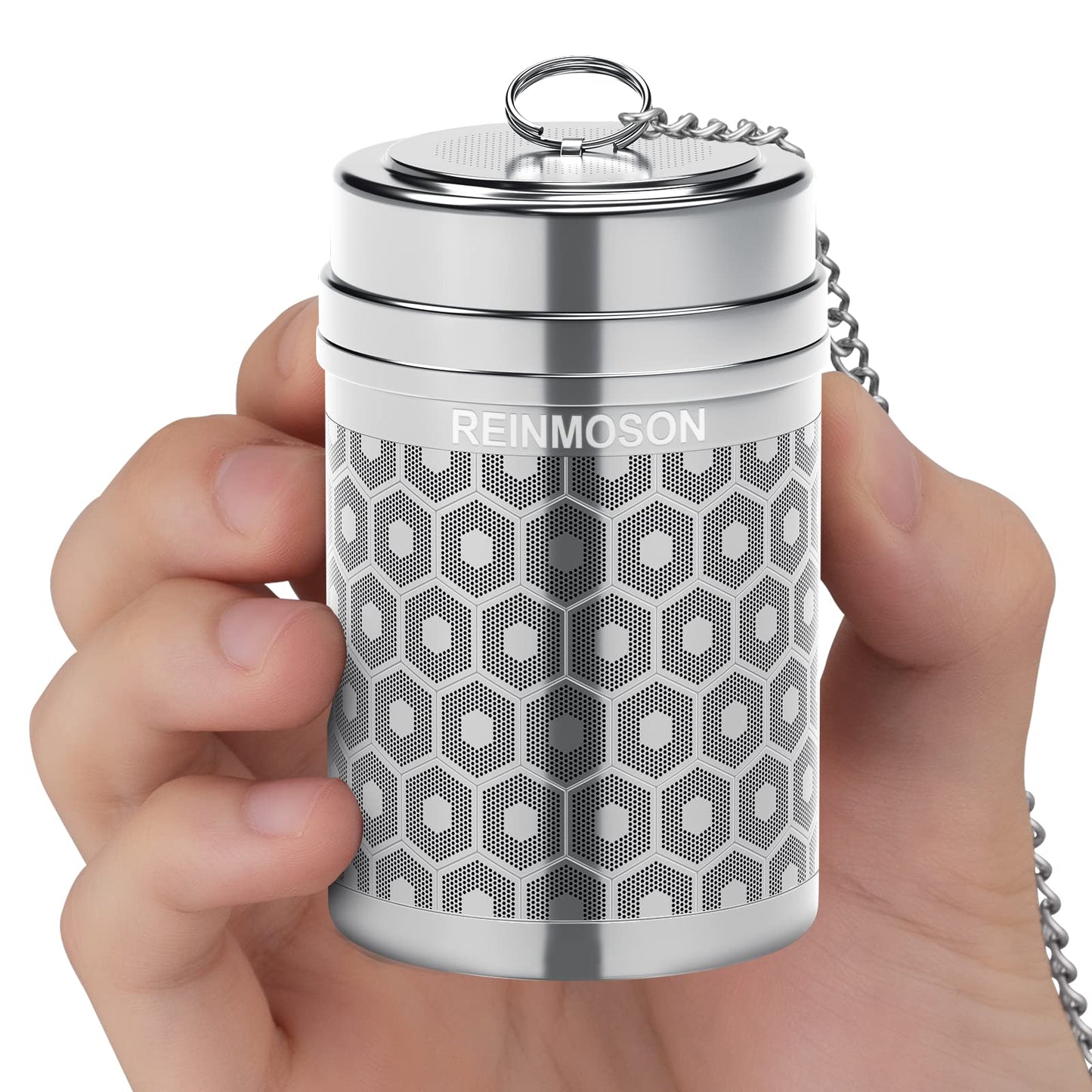 Hand holding a stainless steel Reinmoson Tea Strainer on a white background