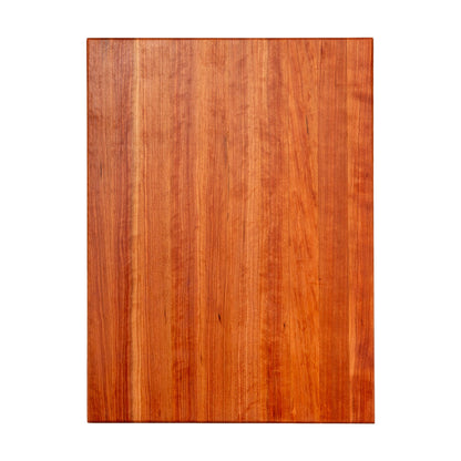 Wooden cutting board with a reddish-brown color on a white background