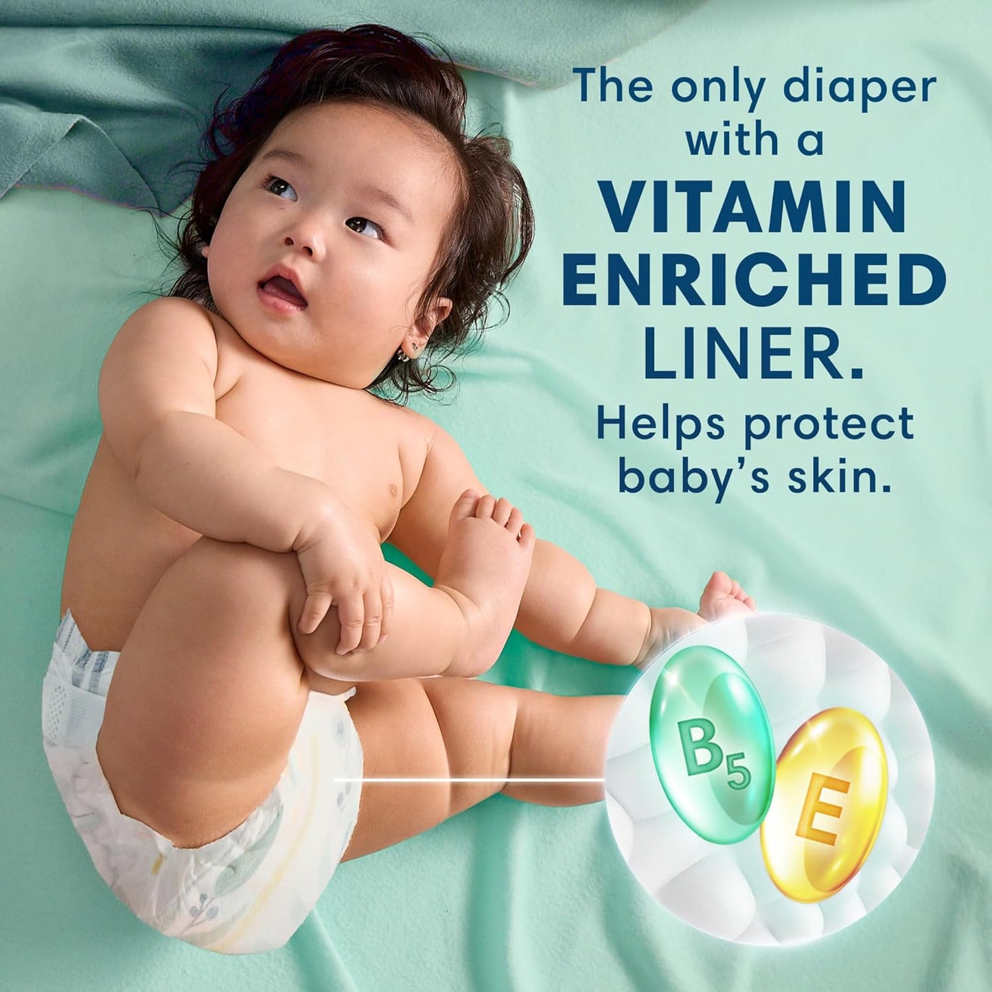 Baby wearing a diaper with text about vitamin-enriched liner on a light green background