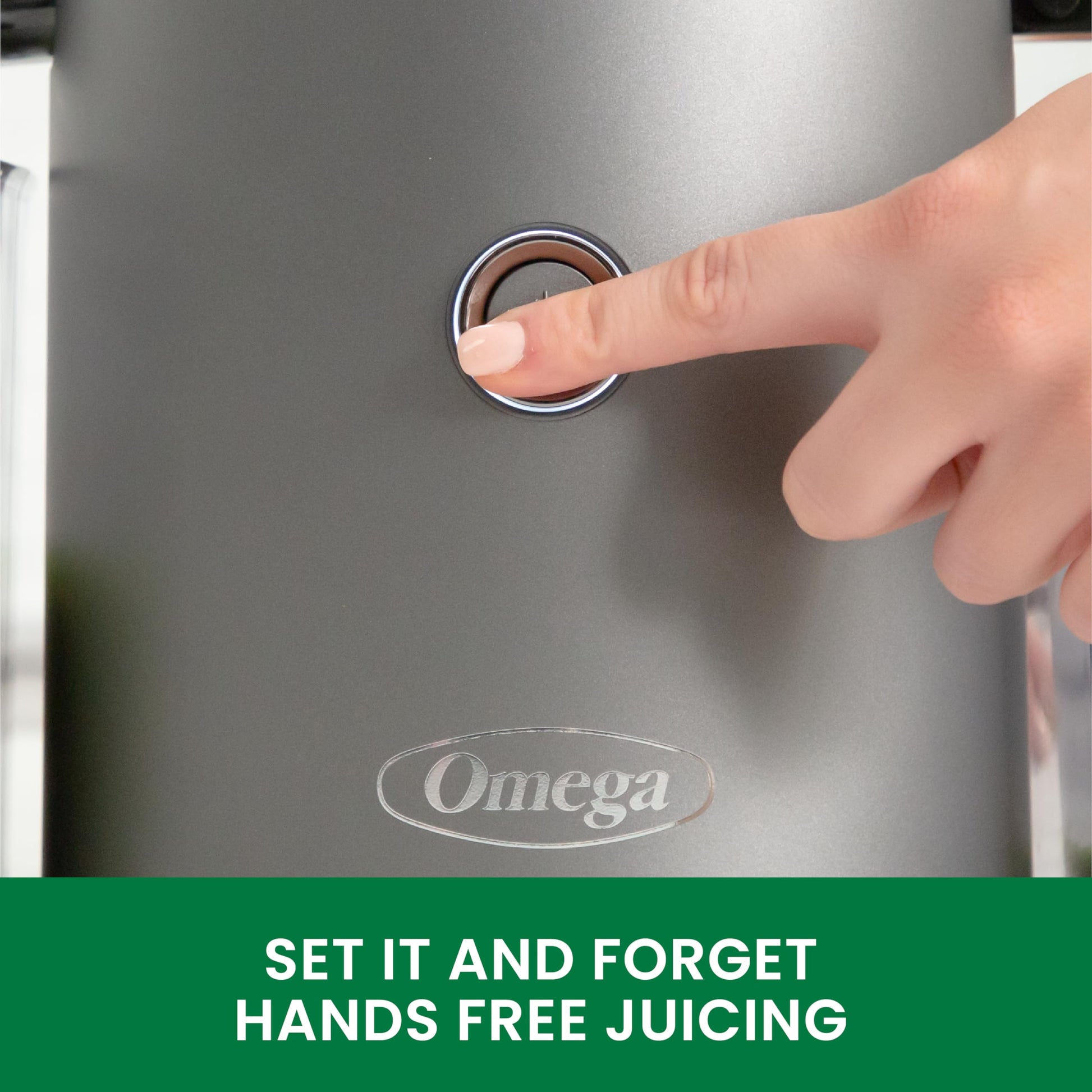 Hand pressing a button on an Omega juicer with text 'Set it and forget hands free juicing'.