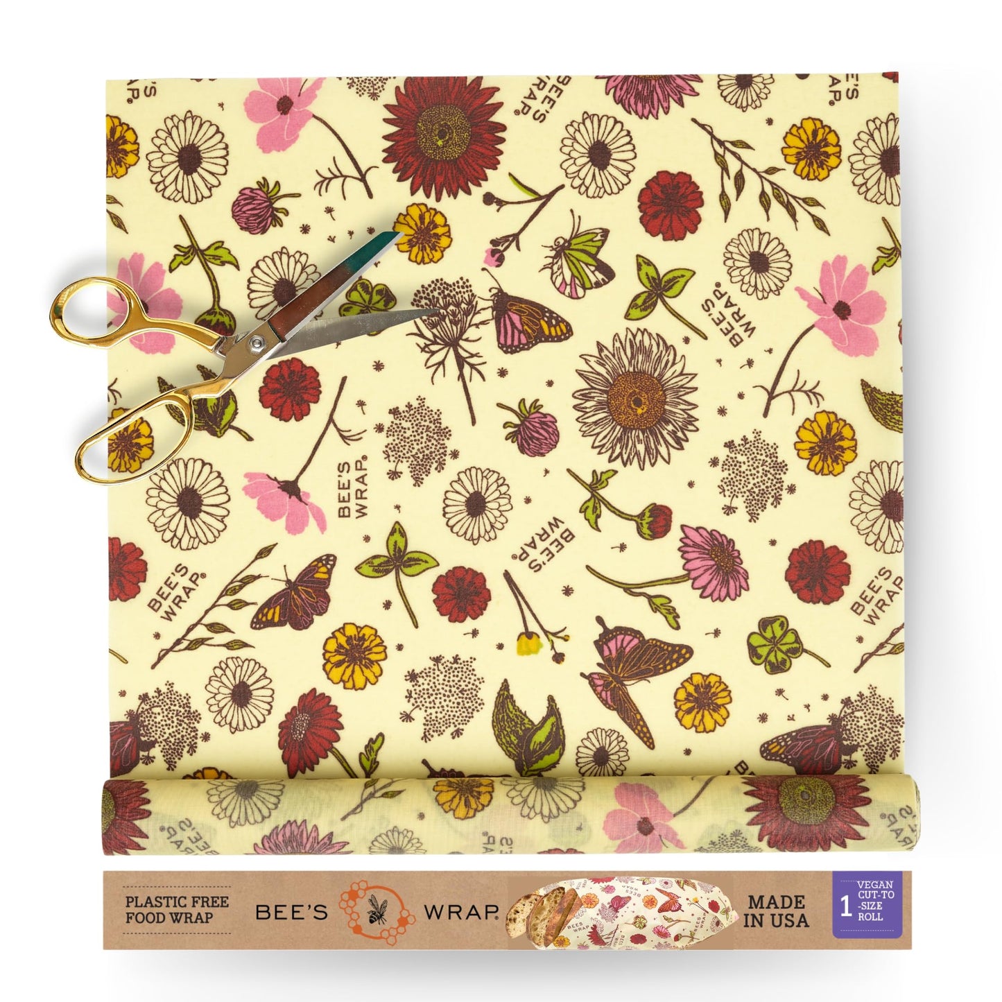 Bees wrap reusable food wrap roll of floral-patterned with scissors and packaging on a white background
