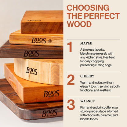 Stack of wooden cutting boards with 'Boos Block' branding, featuring information on wood types.