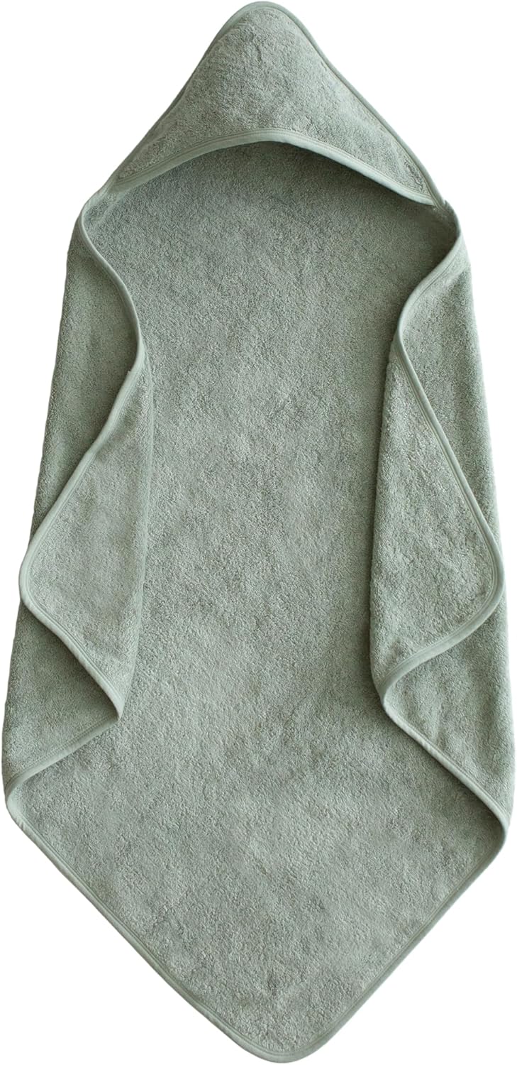 Green towel with a hood on a white background