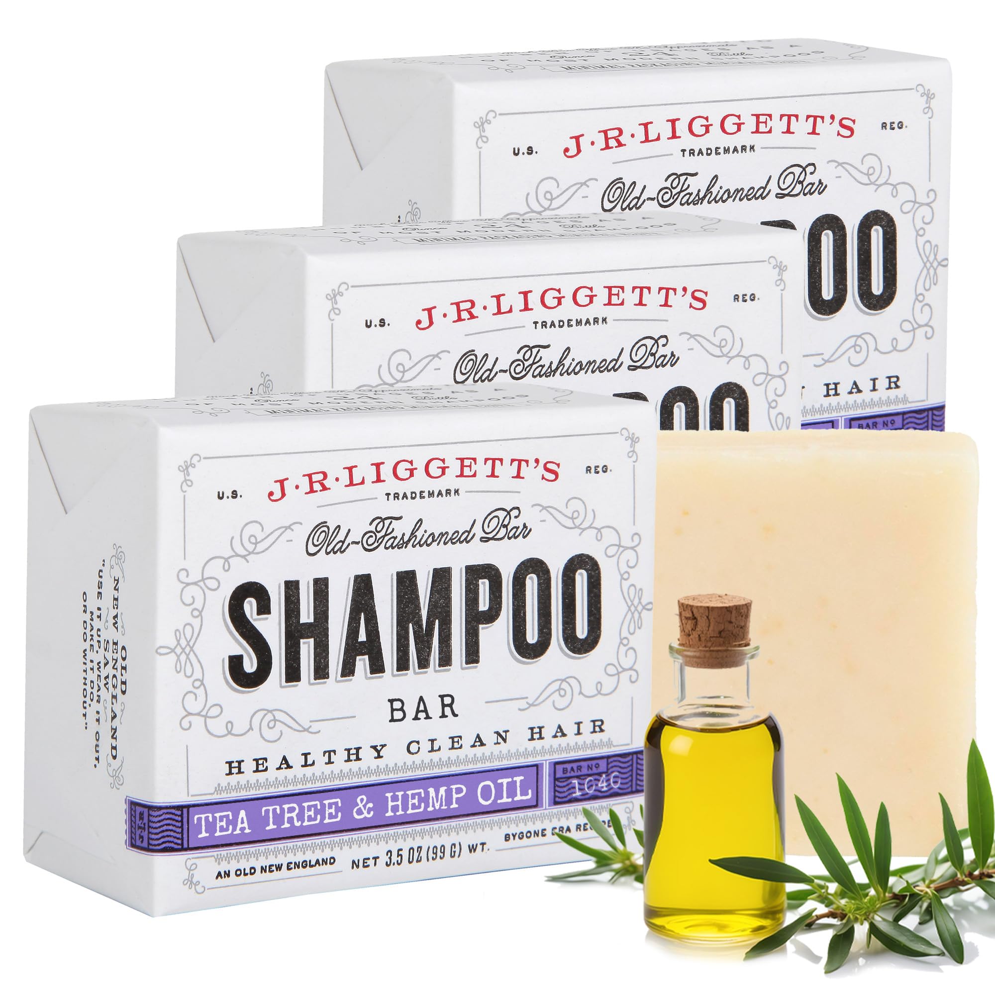 J.R. Liggett's shampoo bar packaging with a bottle of shampoo and tea tree leaves on a white background
