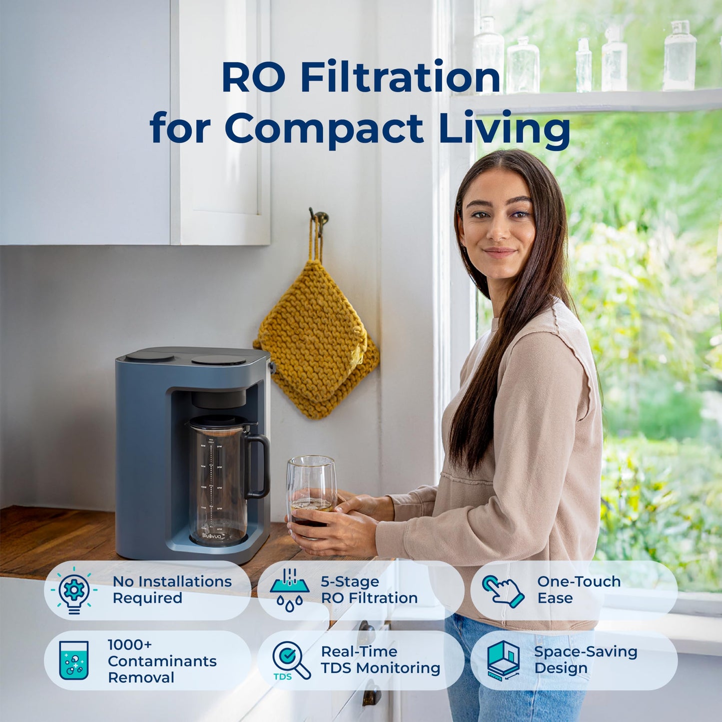 Woman holding a glass of water next to a water filtration device with text about RO Filtration for Compact Living.