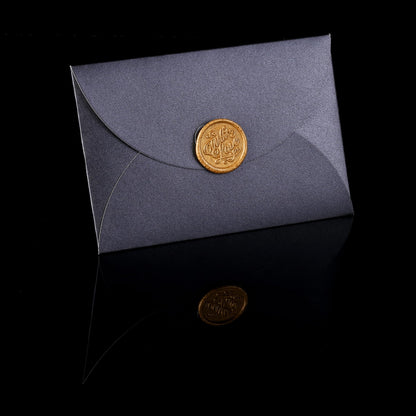 Gray envelope with a gold seal on a black background