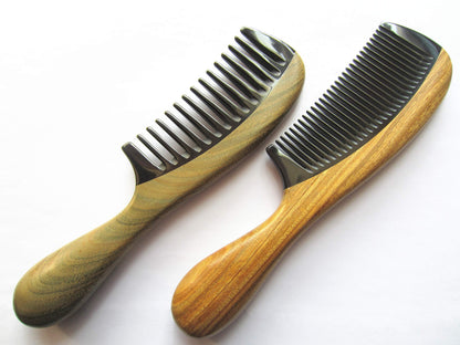 Two wooden combs on a white background