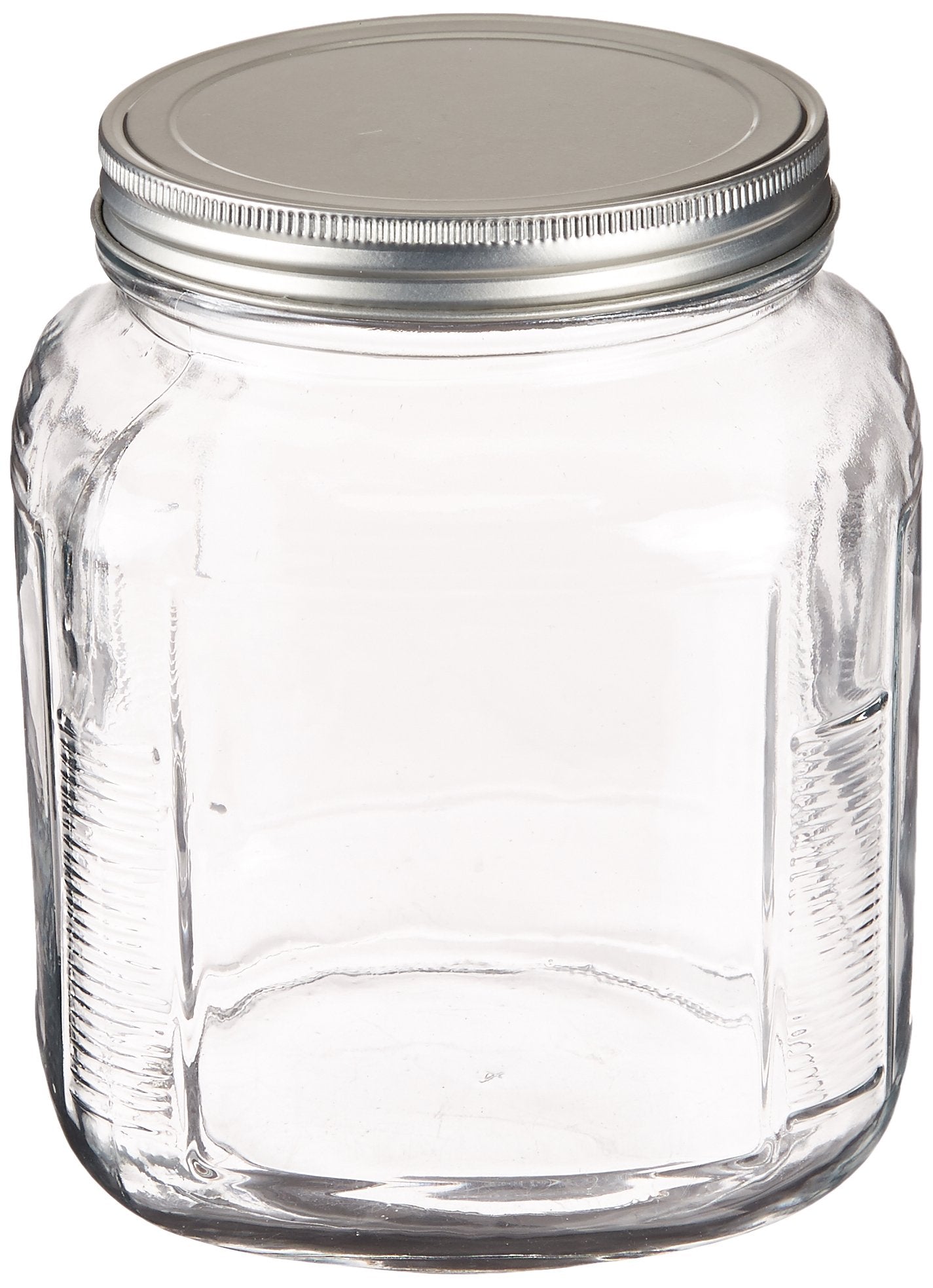 Clear glass jar with a metal lid on a white background