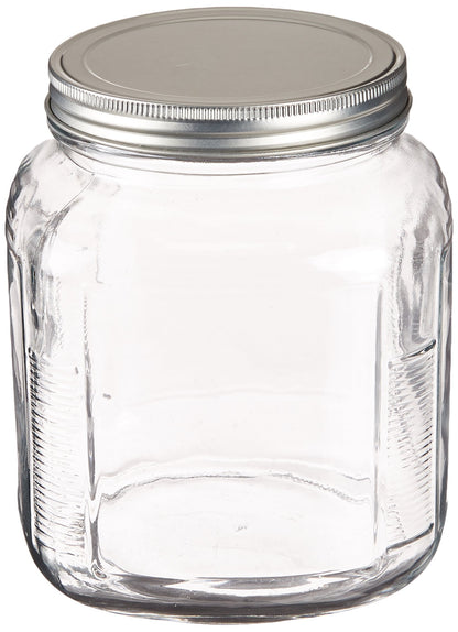 Clear glass jar with a metal lid on a white background