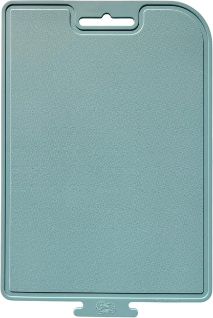 Teal silicon cutting board with a textured surface on a white background