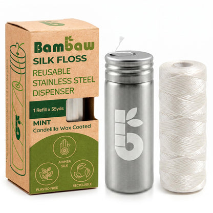 Bambaw silk floss reusable stainless steel dispenser set, featuring a mint wax-coated dispenser, a spool of white silk floss thread, and its brown kraft paper packaging box.