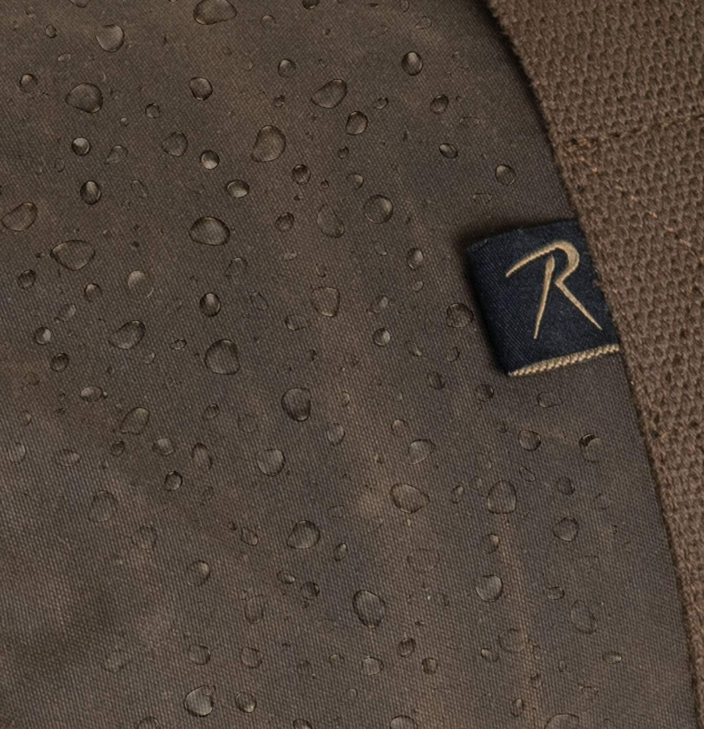 Brown fabric with water droplets and a brand logo on a dark background