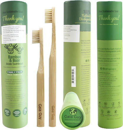 Bamboo toothbrushes and packaging with 'Gaia Guy' branding on a white background